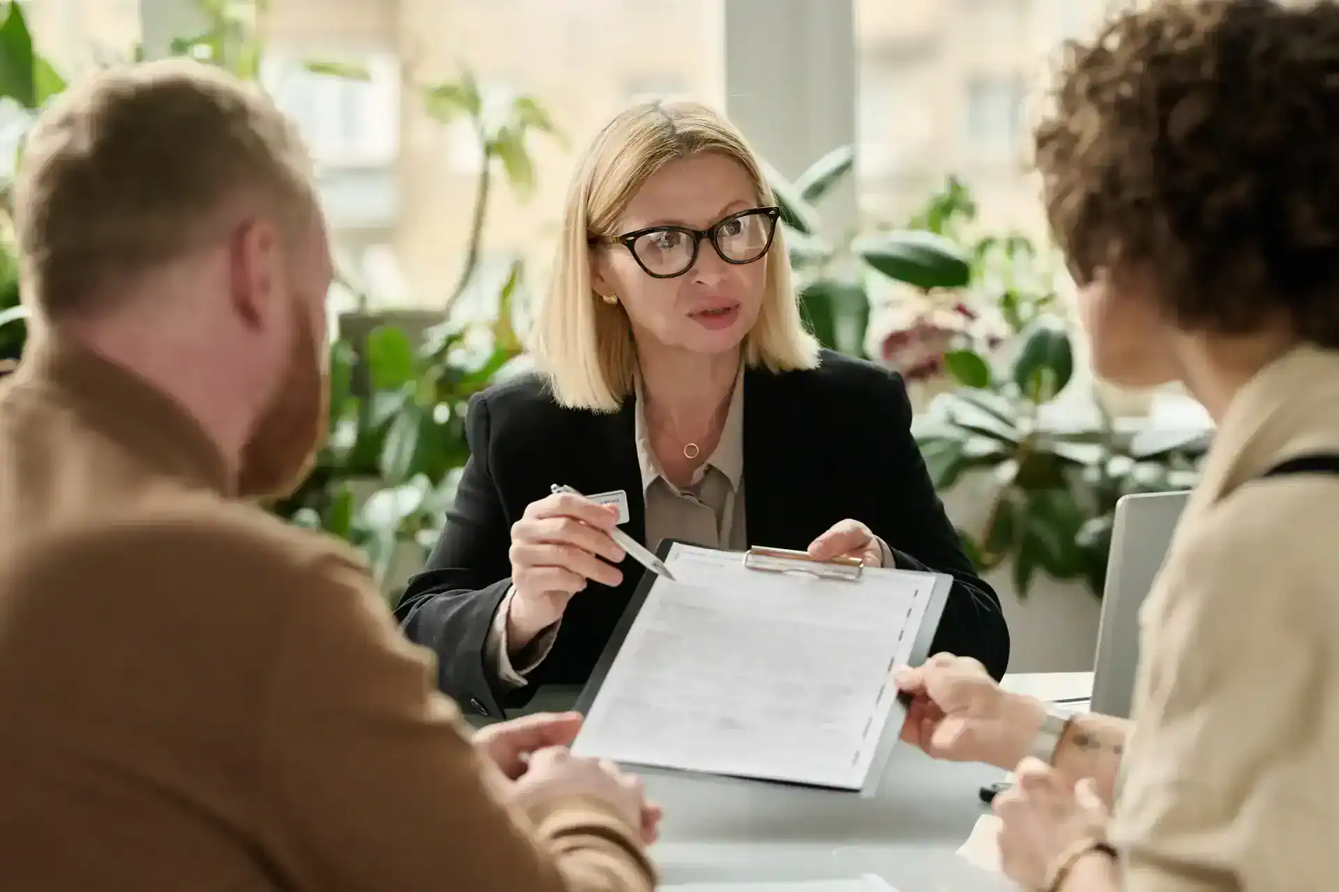 Finance professional explaining a document to customers