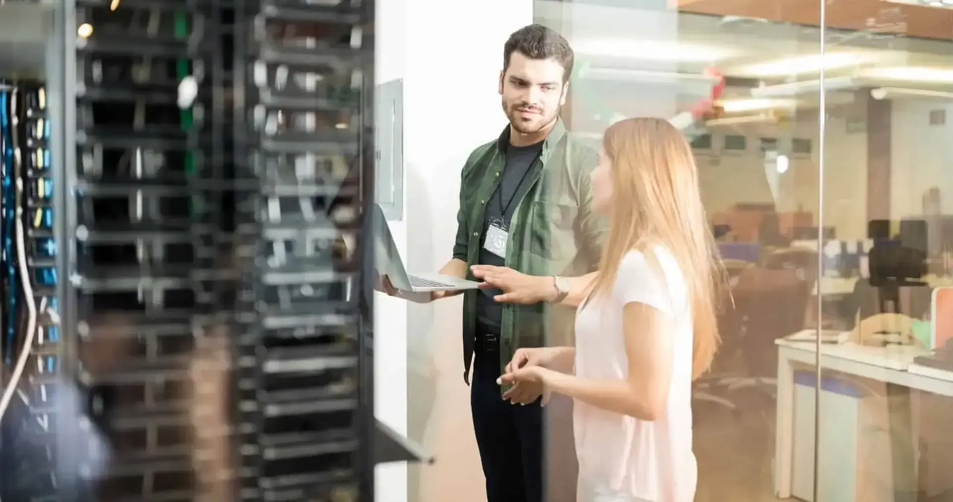 Two IT professionals discussing server infrastructure