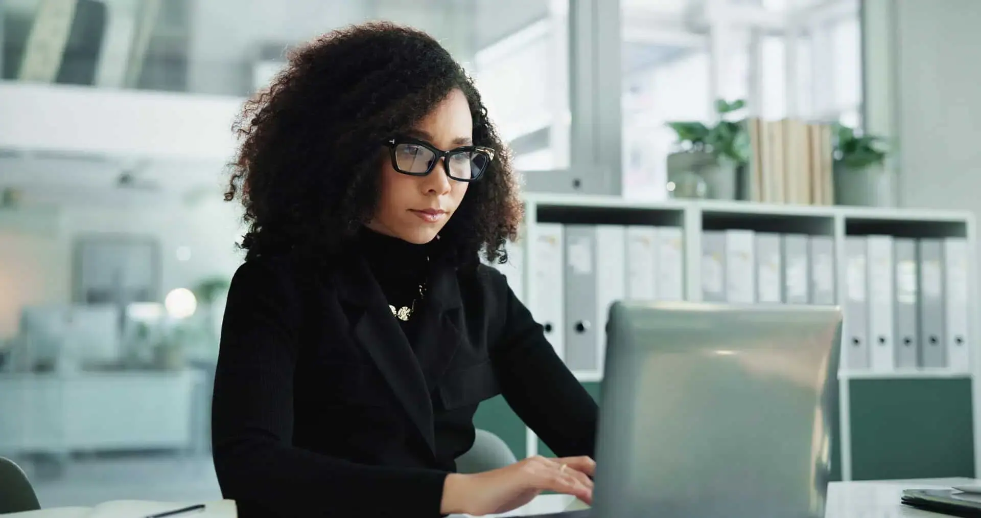 Professional woman working at a laptop