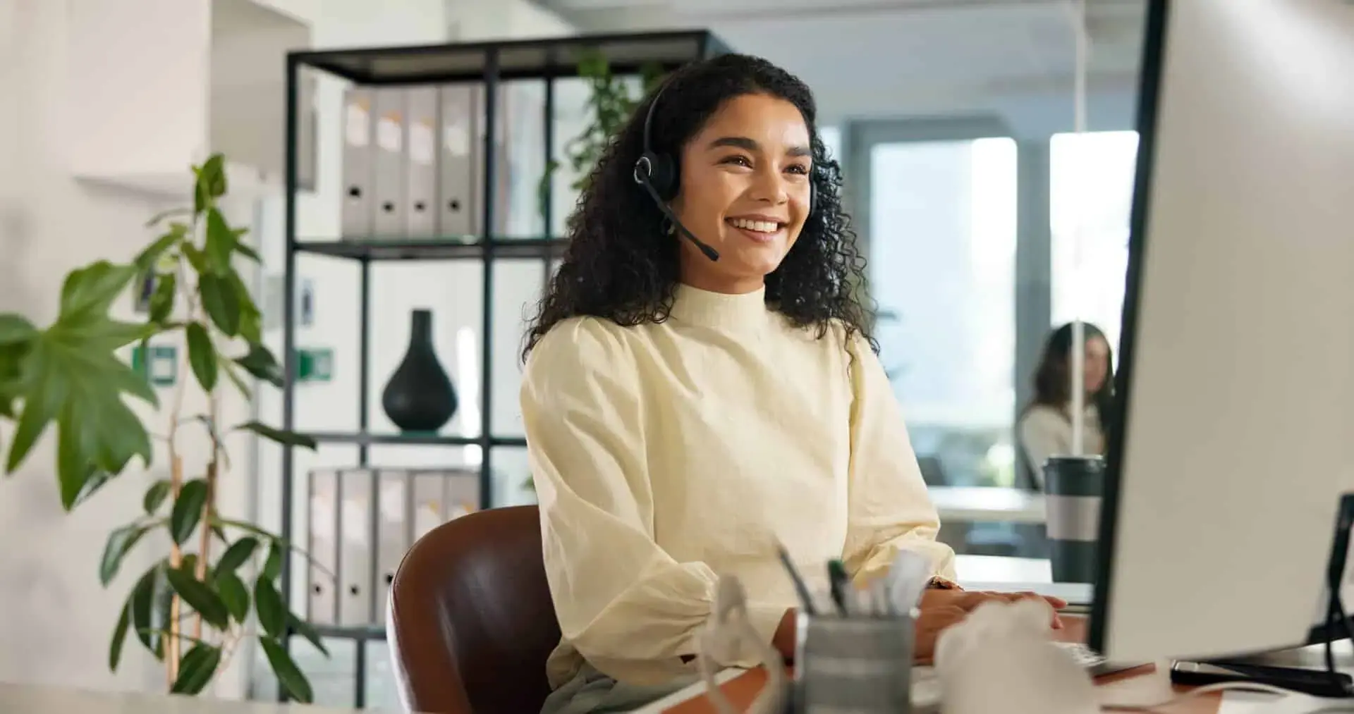 Contact center agent talking on a headset