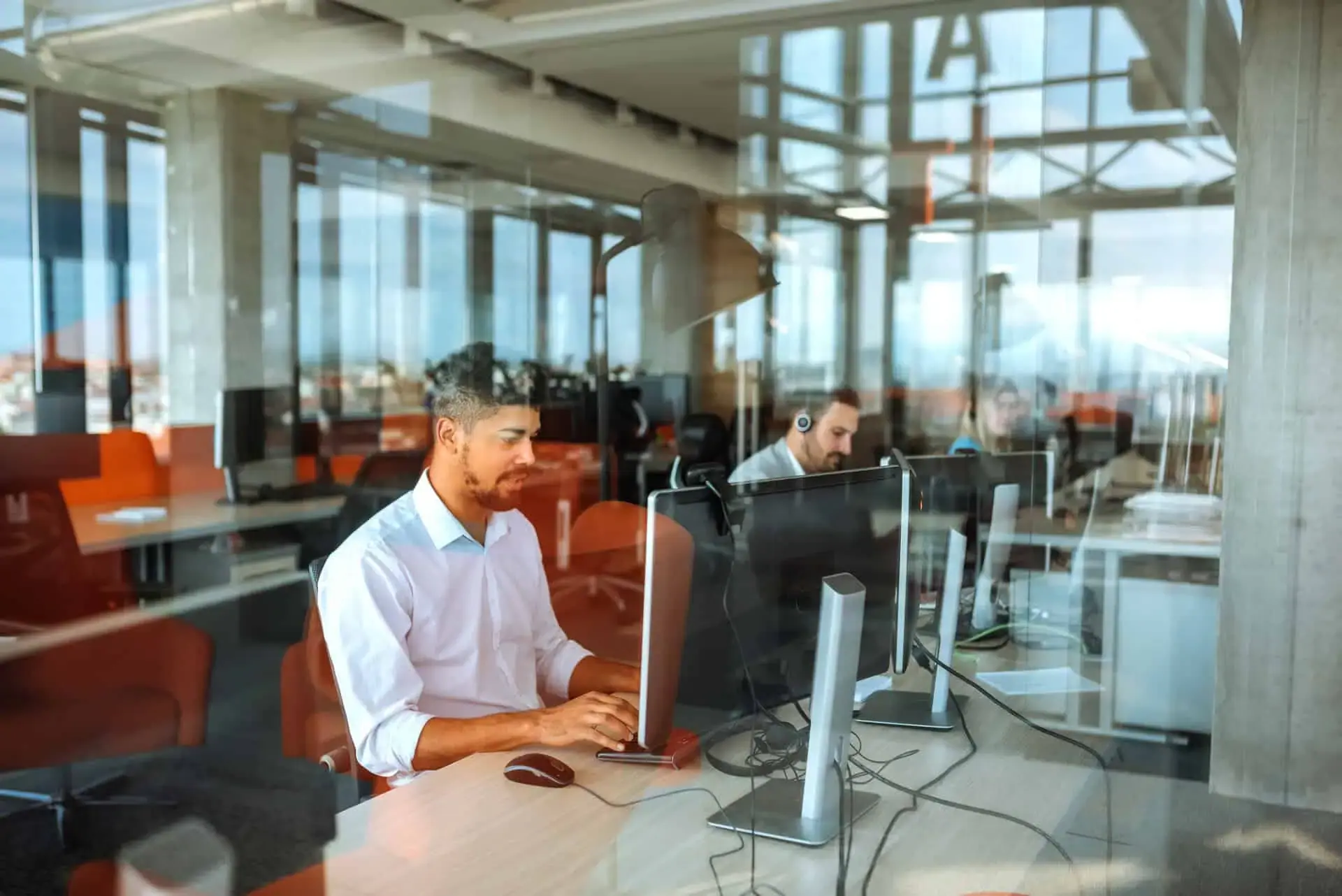 Contact center agents working at their desks