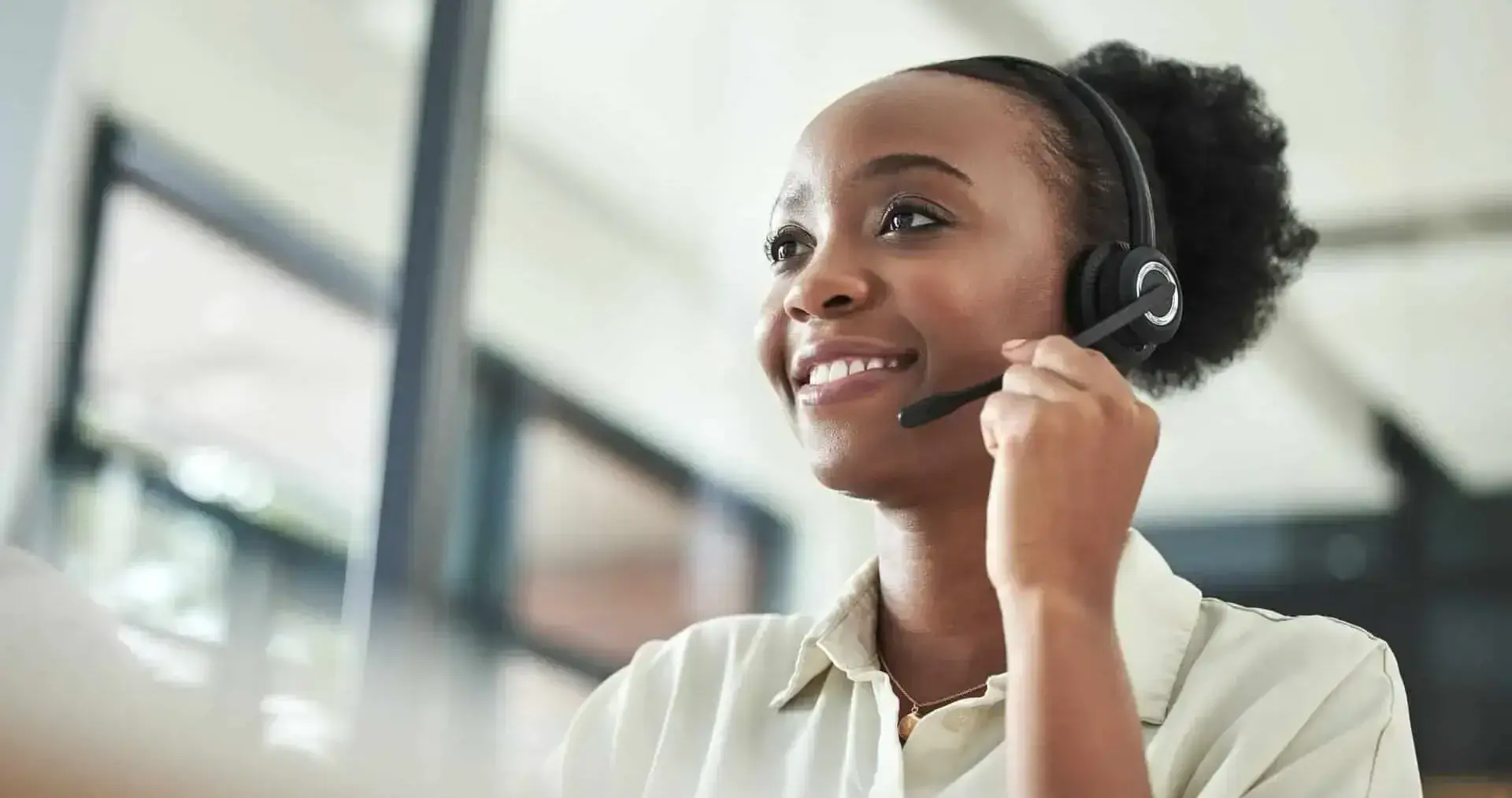 Smiling call center agent wearing a headset