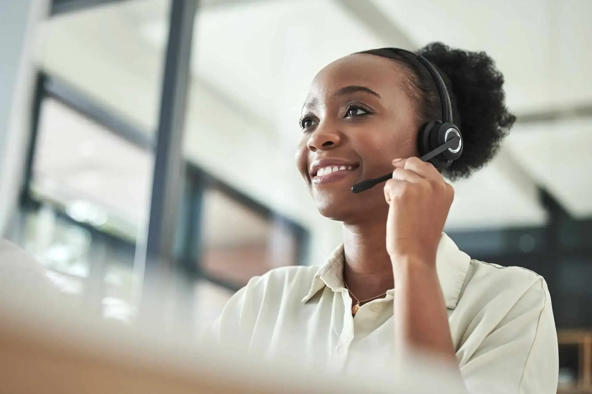 Smiling call center agent wearing a headset