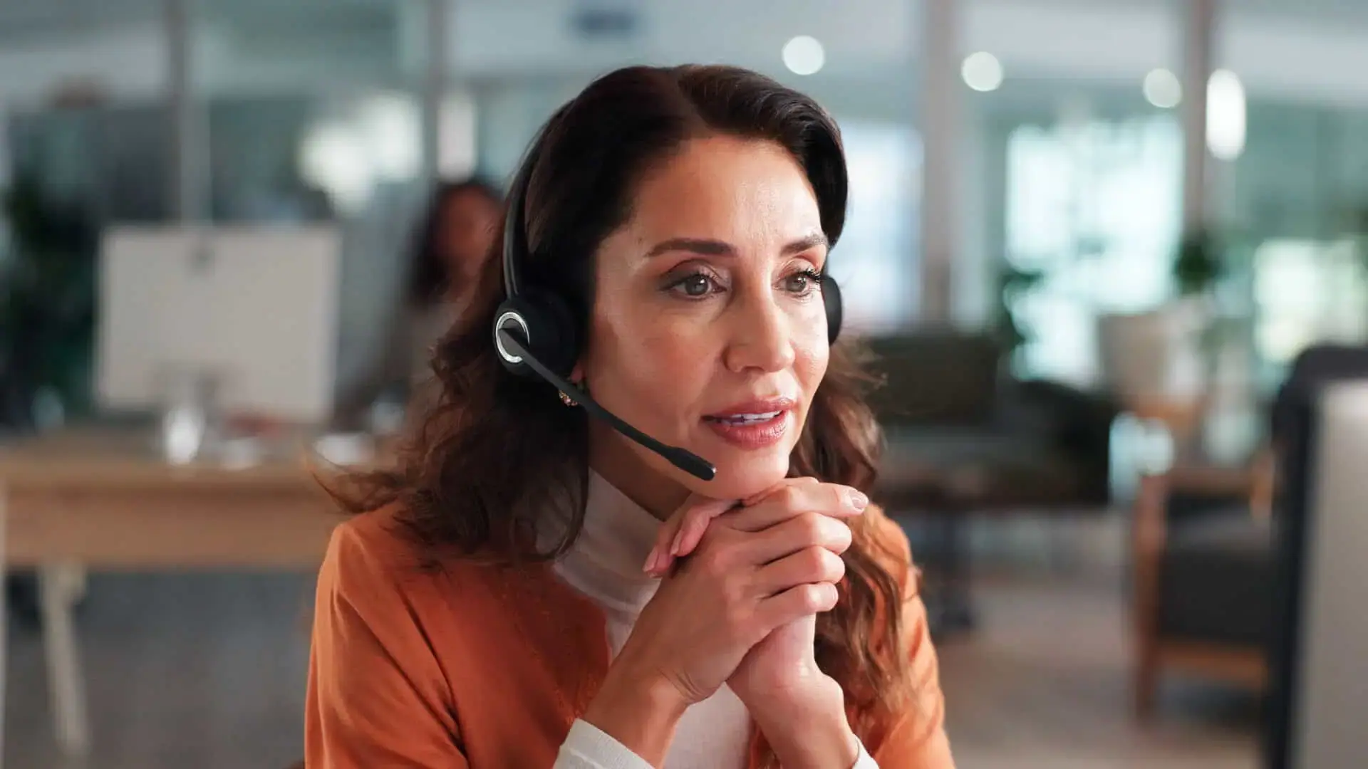 Thoughtful contact center agent on a call